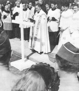 Rev. Joseph F. Tompor, St. Barbara pastor from 1943 – 1966 (the longest pastorship in the parish history), recites prayers before the groundbreaking ceremonies for the new church on April 17, 1955. Ibid.